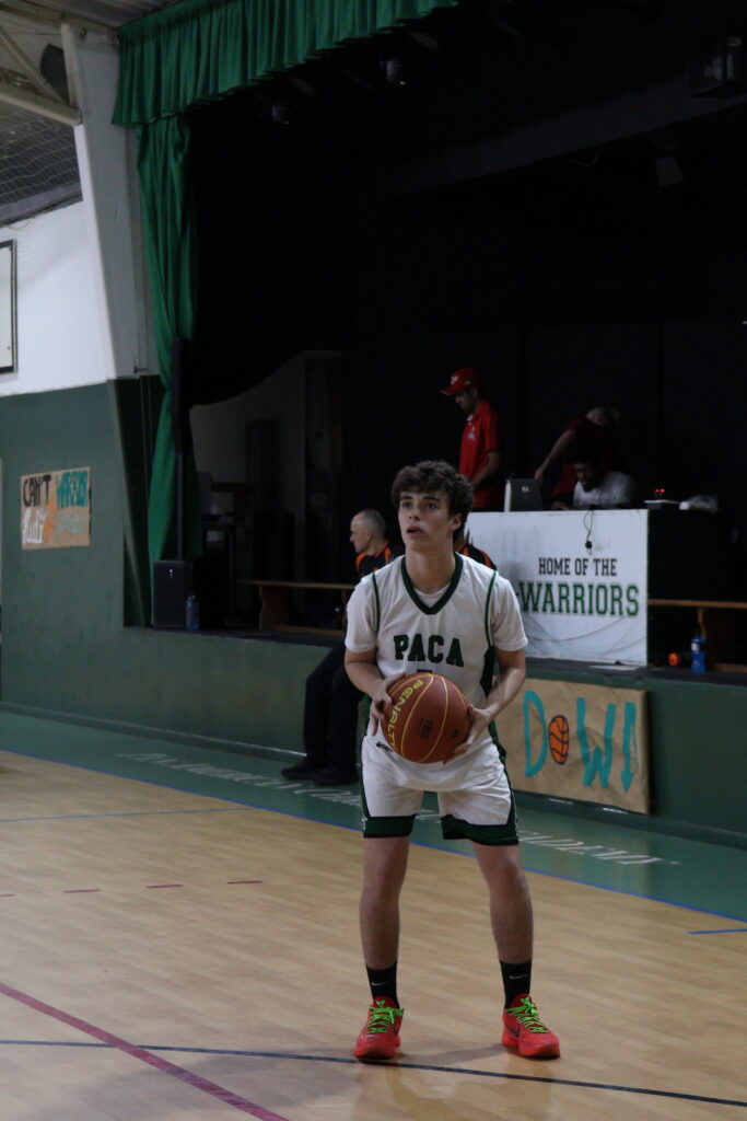 Senior JP Tartoni preparing himself for the shot as his team waits on the offence. [by Samuel Di Lopes.]